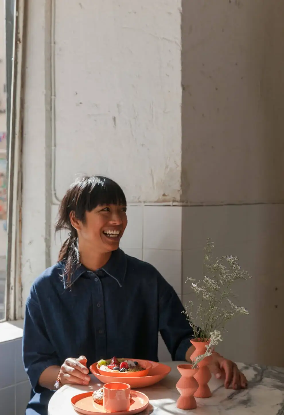 Chef Malaylack smiling and enjoying a delicious lunch at Hello, Kristof in Lisbon